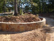 Retaining walls are used to hold back soil, gravel, rocks that might slide down a hill!