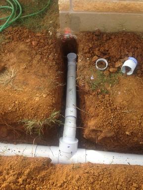 This photo showns a nice example how to will water drain away from the house after installing downspout