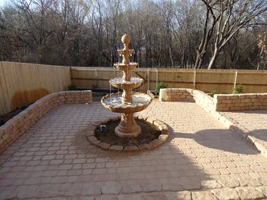 Fencing and fountain by Clean Green, Inc.